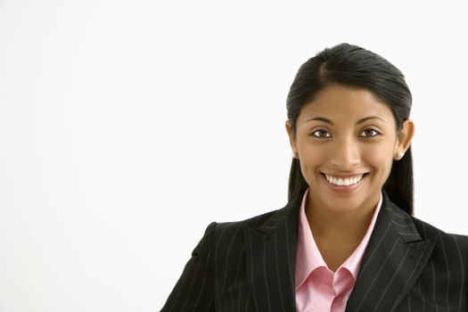 Portrait of smiling businesswoman against white background.