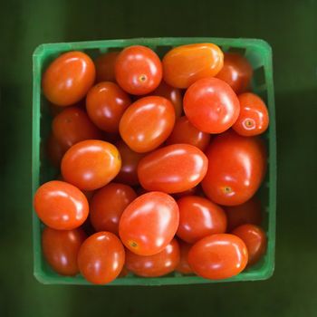 Container of red cherry tomatoes.