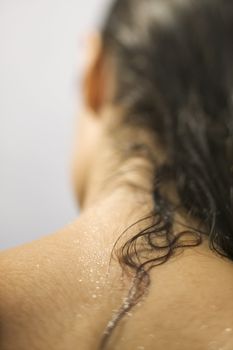 Close up of young woman's wet neck and hair.