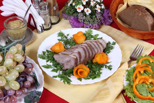 Nourishing dinner with pork, vegetables and fruits