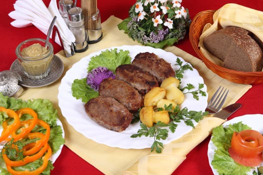 Nourishing dinner with cutlets, vegetables and a potatos