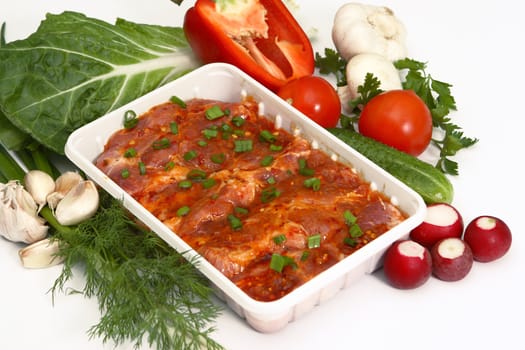 Crude meat, vegetables, greens and seasoning