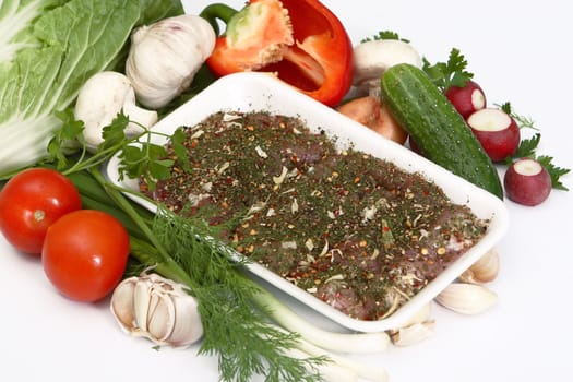 Crude meat, vegetables, greens and seasoning