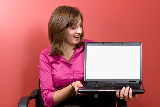 Business woman with a laptop - clipping path for the screen area isolation is included.