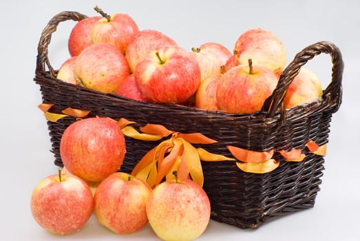 Basket with apples on the white background