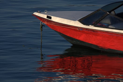 tip of red and white speedboat at the port of Socoa