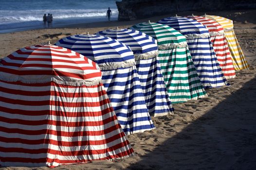 colorful array of tents on the beach in Biarritz, Basque Country, France