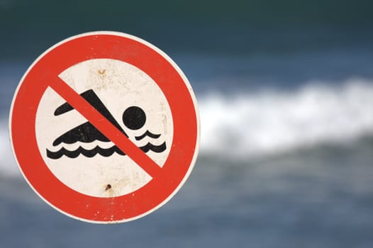 sign prohibiting bathing in the ocean, real state