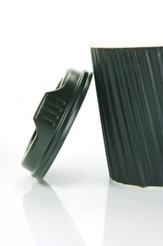 Takeaway coffee cups isolated against an orange background