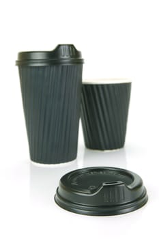 Takeaway coffee cups isolated against an orange background