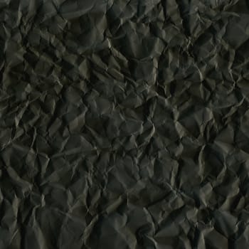 Dark black rippled paper sheet