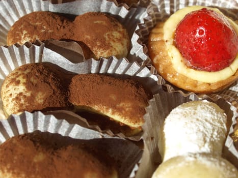 Mixed pastries with chocolate, cream, fruit
