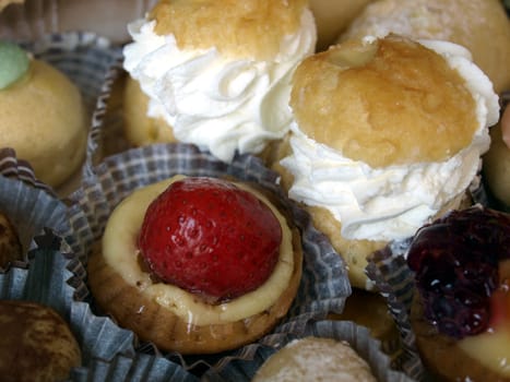 Mixed pastries with chocolate, cream, fruit