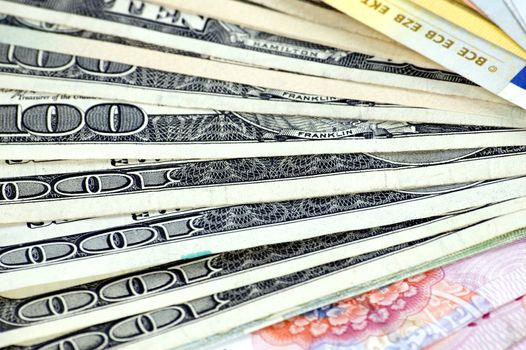 USD, Euro and RMB setup in fan shape. Photo of different banknotes, money in different shapes and colors. Useful for financial, economic backgrounds.