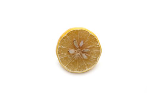 Half of the lemon, cut dry on white background