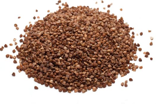 Heap buckwheat croups, disposit on white background