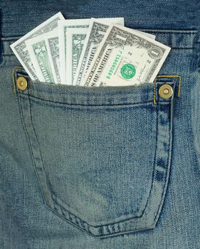 Batch dollars in hip-pocket on blue jeans