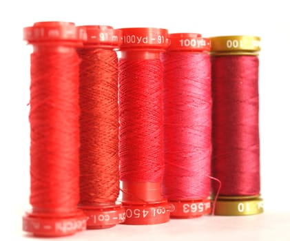 Red sewing threads spools