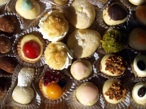 Mixed pastries with chocolate, cream, fruit