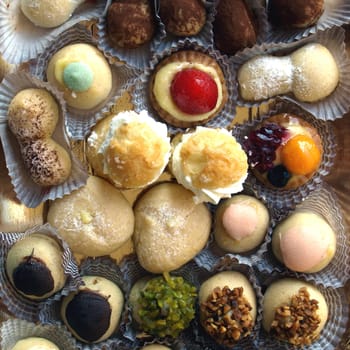 Mixed pastries with chocolate, cream, fruit
