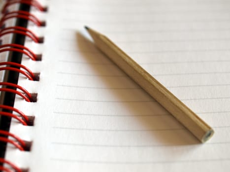 Notebook note pad page with pencil