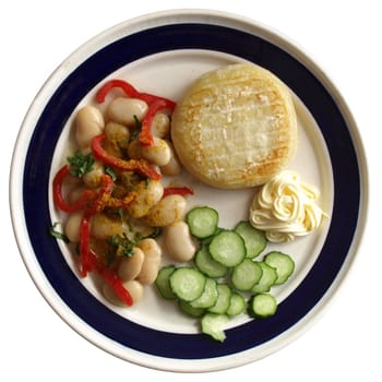 Vegetarian main dish including cheese, mayonnaise, curry beans, peppers and cucumbers