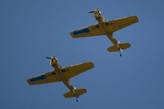 Acrobatic airplanes perform during the airshow on July 17, 2010 on Henri Coanda airport, Bucharest, Romania.