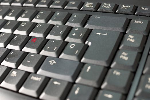 Spanish language keyboard with its distinctive letter highlighted in red