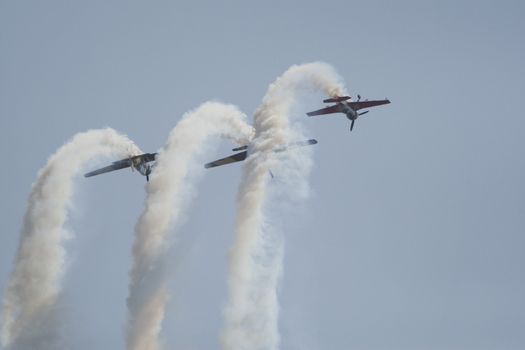 Acrobatic airplanes perform during the airshow on July 17, 2010 on Henri Coanda airport, Bucharest, Romania.