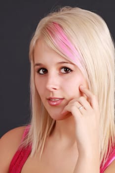 cute young blond girl, dark background