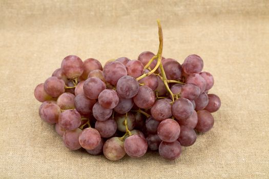 Bunch of grapes on the sacking background