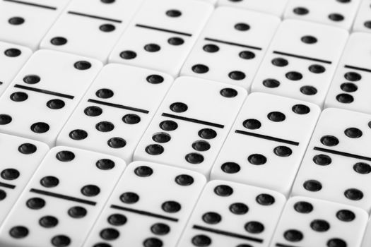 Background from white spotted dominoes pieces