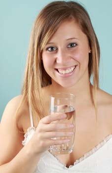 young caucasian woman holding a glass of fresh water