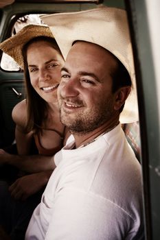 Portrait of Cowboy and woman in pickup truck cab