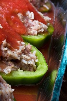 stuffed peppers cut in to slices with tomato sauce 