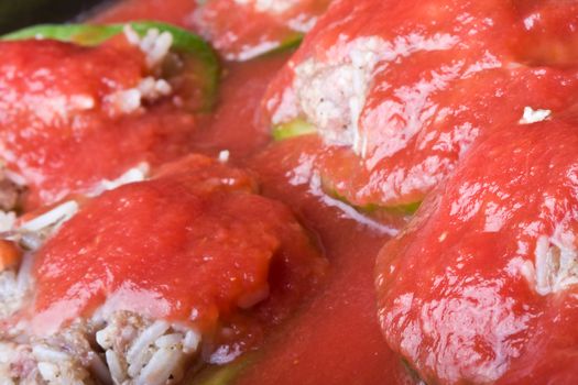 stuffed peppers cut in to slices with tomato sauce 
