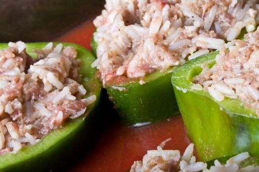 stuffed peppers cut in to slices with tomato sauce 