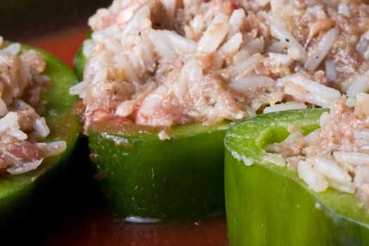 stuffed peppers cut in to slices with tomato sauce 