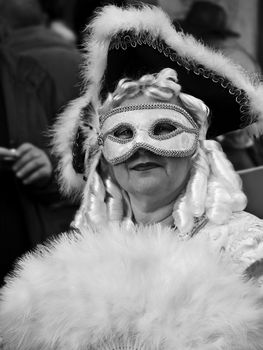 VALLETTA, MALTA - Feb 21st 2009 - Old lady wearing beautiful Venetian style masks and costumes at the International Carnival of Malta 2009