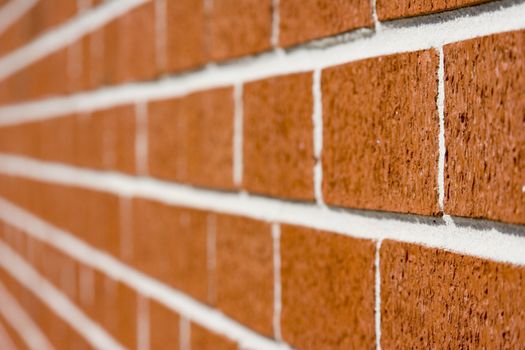 red brick wall close up shot with selective focus drifting off to blurry.