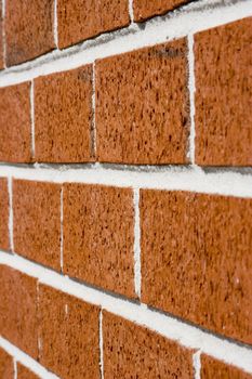 red brick wall close up shot with selective focus drifting off to blurry.