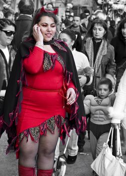 VALLETTA, MALTA - Feb 21st 2009 - Overweight woman dressed up as a devilish temptress at the International Carnival of Malta 2009