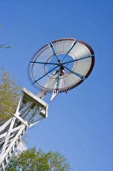 old windmill against a blue sky nice green background image