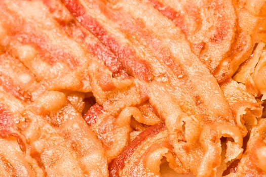 close up of cooked bacon fresh off the stove