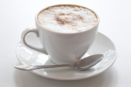 Cup of hot cappuccino, close-up