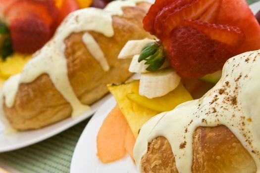 a light and healthy breakfast fresh fruit on white china