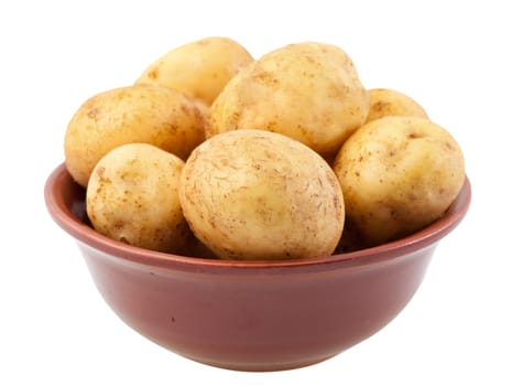 Many young potatoes in a clay bowl isolated on white background