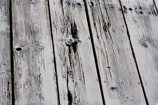 Close up of old dried up paint peeling lumber