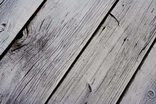 Close up of old dried up paint peeling lumber