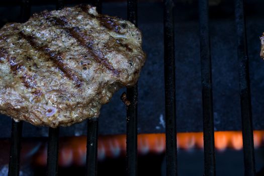 Grilling burgers on the bbq in the backyard for summer fun